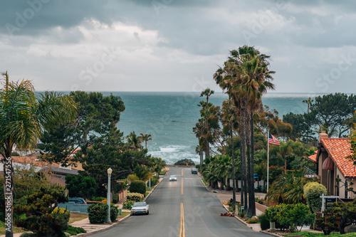 A street with view of the Pacific Ocean on a cloudy day, in Point Loma, San Diego, California
