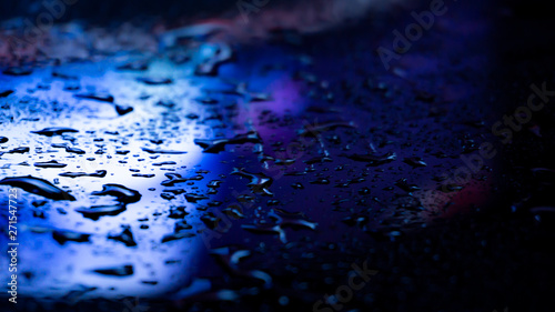 Dark background. Spilled li...