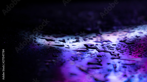 Dark background. Spilled li...