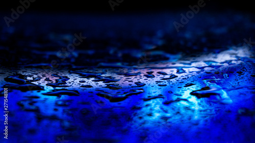 Dark background. Spilled li...