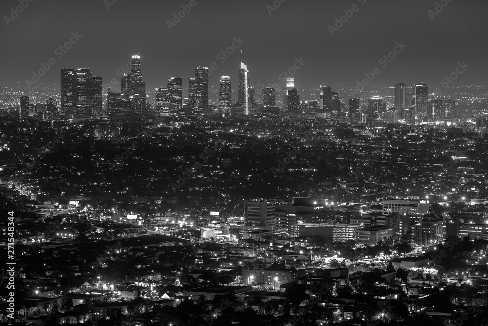 Cityscape view of the downtown skyline at night, from Griffith Observatory, in Los Angeles, California - obrazy, fototapety, plakaty 