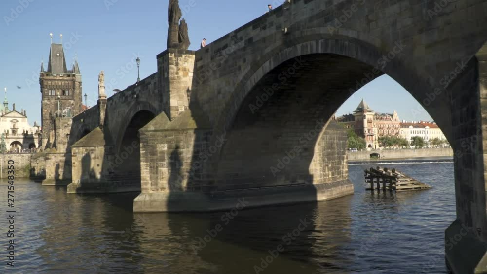 Charles Bridge From The Tourist Prague  Boat float under bridge At Vltava River. Prague.