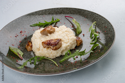 Risotto with porcini mushrooms. traditional Italian dish. On white background