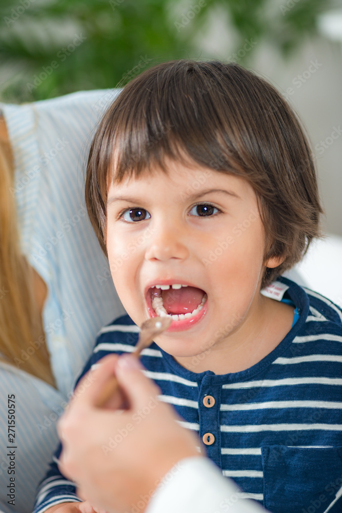 Homeopathy. Mother and little boy visiting a homeopath Homeopathy. Mother and little boy visiting a homeopath