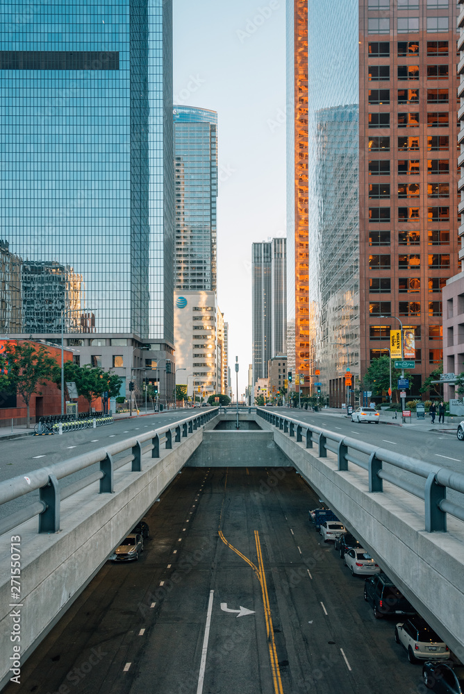 Cityscape view of underpass on Grand Avenue and modern buildings in downtown Los Angeles, California
