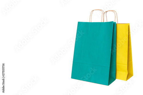 Yellow and green paper shopping bags isolated. Top view