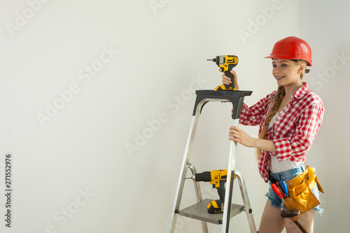 Woman with repairing tools and ladder