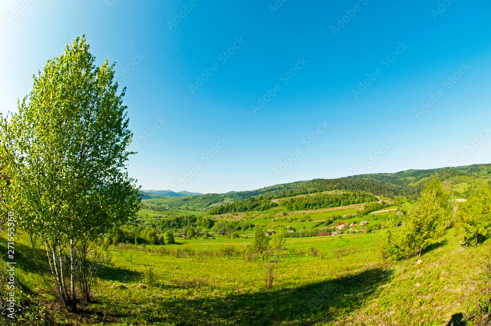 beautiful mountain valleys and mountains on a bright sunny day on the background of a wide valley