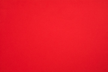 Crimson red felt texture abstract art background. Colored fabric fibers surface. Empty space.