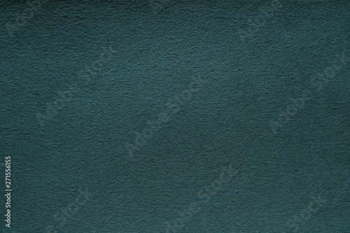 Dark teal green felt texture abstract art background. Corduroy textile pattern surface. Copy space.