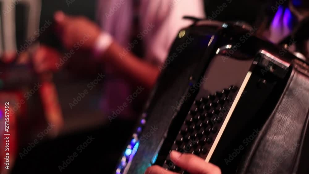 An extremely closeup of an accordionist playing accordion during a cultural music event in Brazil, Rio de Janeiro