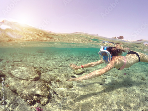 Woman snorkeling close to c...