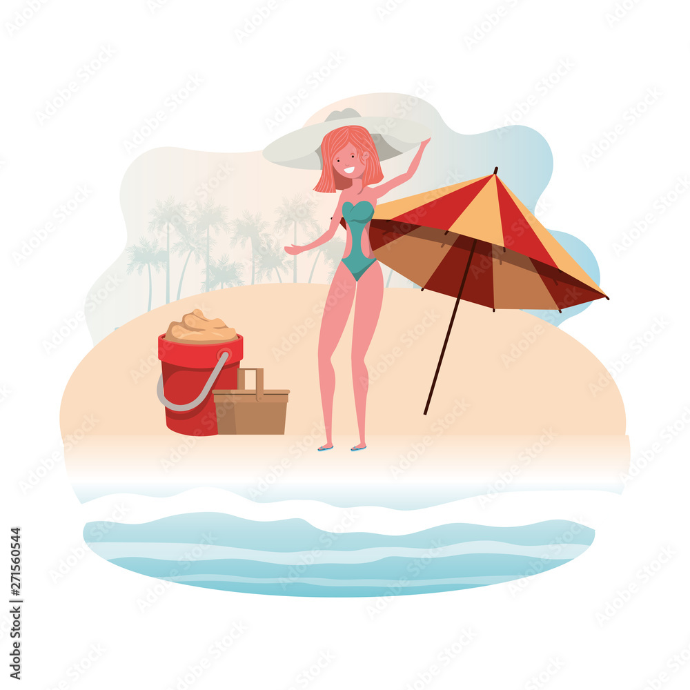 woman with swimsuit on the beach and umbrella