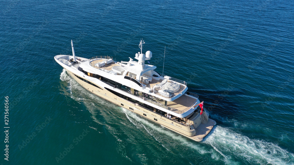 Aerial drone photo of luxury yacht cruise in mediterranean deep blue sea