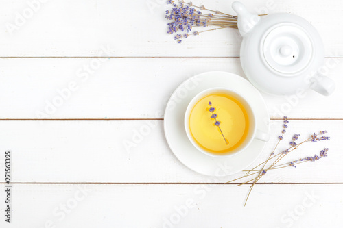 teapot and cups of tea on a white wooden background