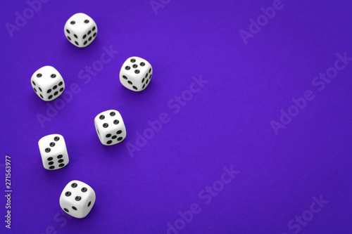 White dices against a blue background