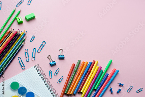 Concept back to school. School supplies on pink background. Copy space