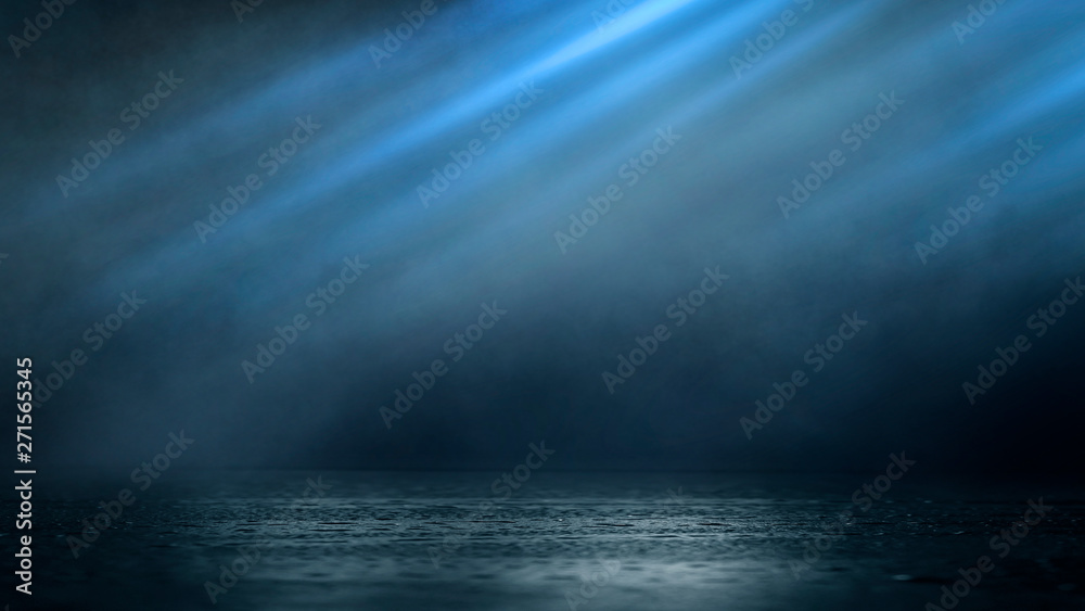 Wet asphalt, reflection of neon lights, a searchlight, smoke. Abstract light in a dark empty street with smoke, smog. Dark background scene of empty street, night view, night city.