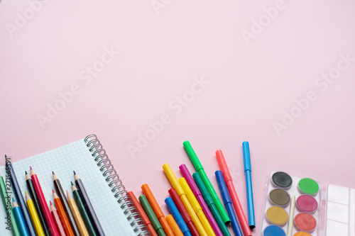 School supplies lay on color background, back to school concept, copy space