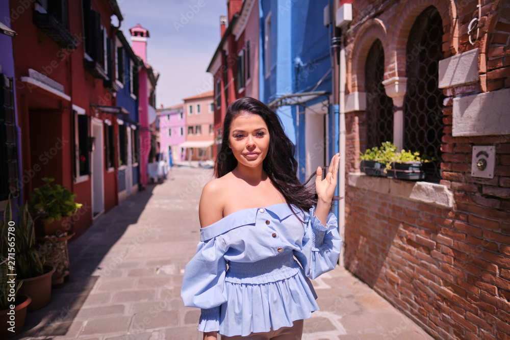 Fototapeta premium Young tourist woman walks in the old town. Italy.