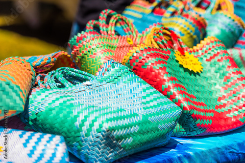 Woven bags on the market, Rarotonga, Aitutaki, Cook Islands. With selective focus. © ggfoto