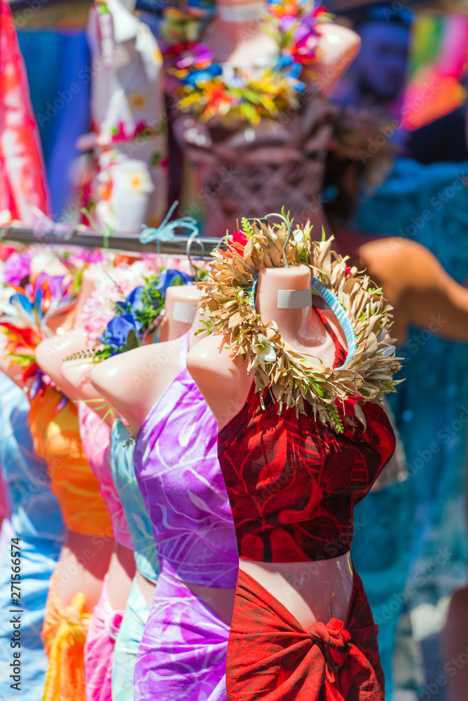 Mannequins in clothing in the local market, Rarotonga, Aitutaki, Cook Islands. With selective focus. Vertical.