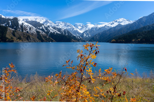 Fototapeta Naklejka Na Ścianę i Meble -  Highland lake landscape with background snowy mountain scene in autumn at Xinjiang, china