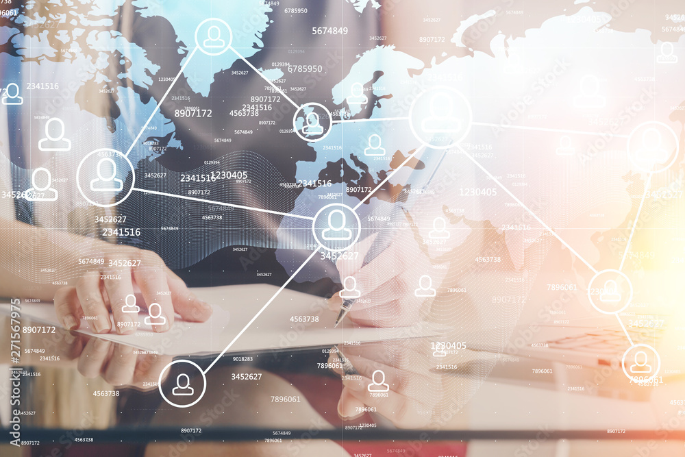 Social network theme hologram over hands taking notes background. Concept of global international people connect. Double exposure Social network theme hologram over hands taking notes background. Concept of global international people connect. Double exposure
