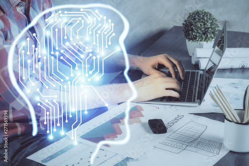 Man with computer background with brain theme hologram. Concept of brainstorm. Double exposure.