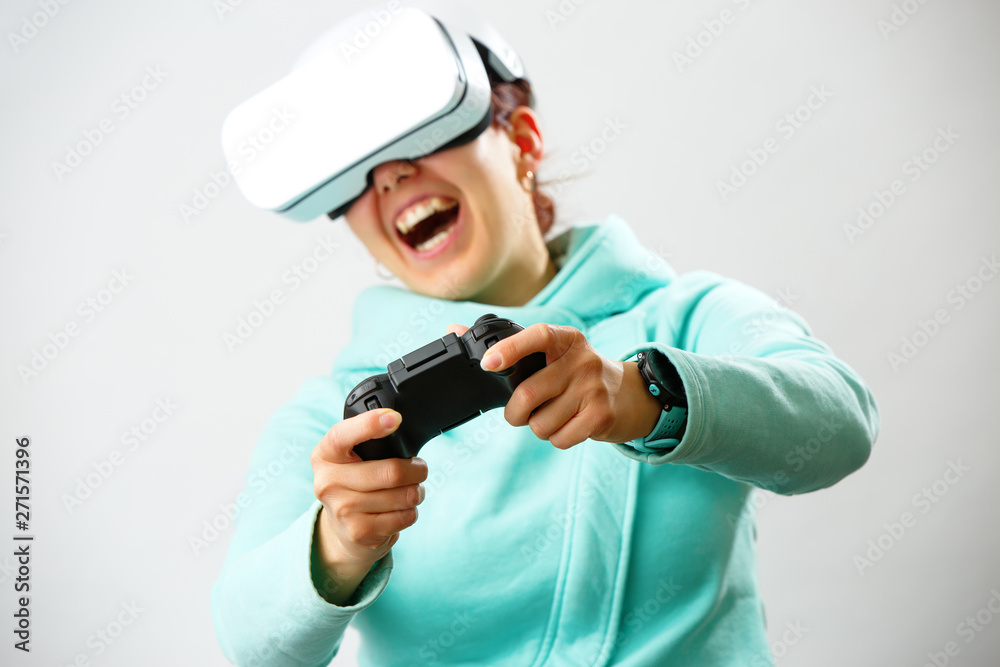 Woman with virtual reality headset is playing game. Woman with virtual reality headset is playing game.