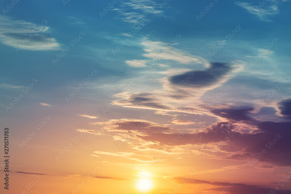 Dramatic colorful sunset or sunrise sky landscape. Natural beautiful dawn background wallpaper. Twilight time cloudscape