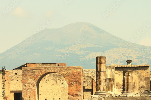 Ancient ruins in Pompeii against backdrop of great volcano Vesuvius, Naples, Italy.
