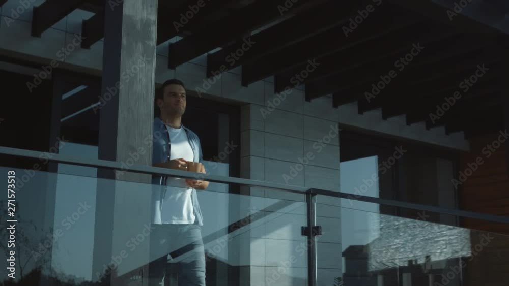 Handsome man drinking coffee in modern exterior outside. Casual man enjoy tea. Handsome man drinking coffee in modern exterior outside. Casual man enjoy tea.