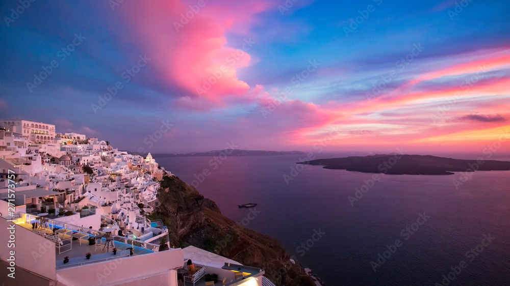 Beautiful sunset on the island of Santorini, Greece. A view of the village of Fira. - Image