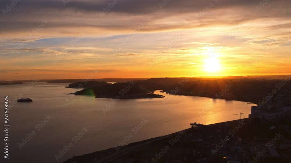 Aerial view in the city of Puerto Montt with beautiful sunset colors reflected in its bay and buildings Aerial view in the city of Puerto Montt with beautiful sunset colors reflected in its bay and buildings