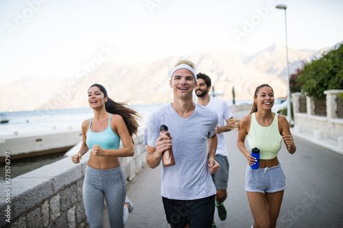 Friends fitness training together outdoors living active healthy