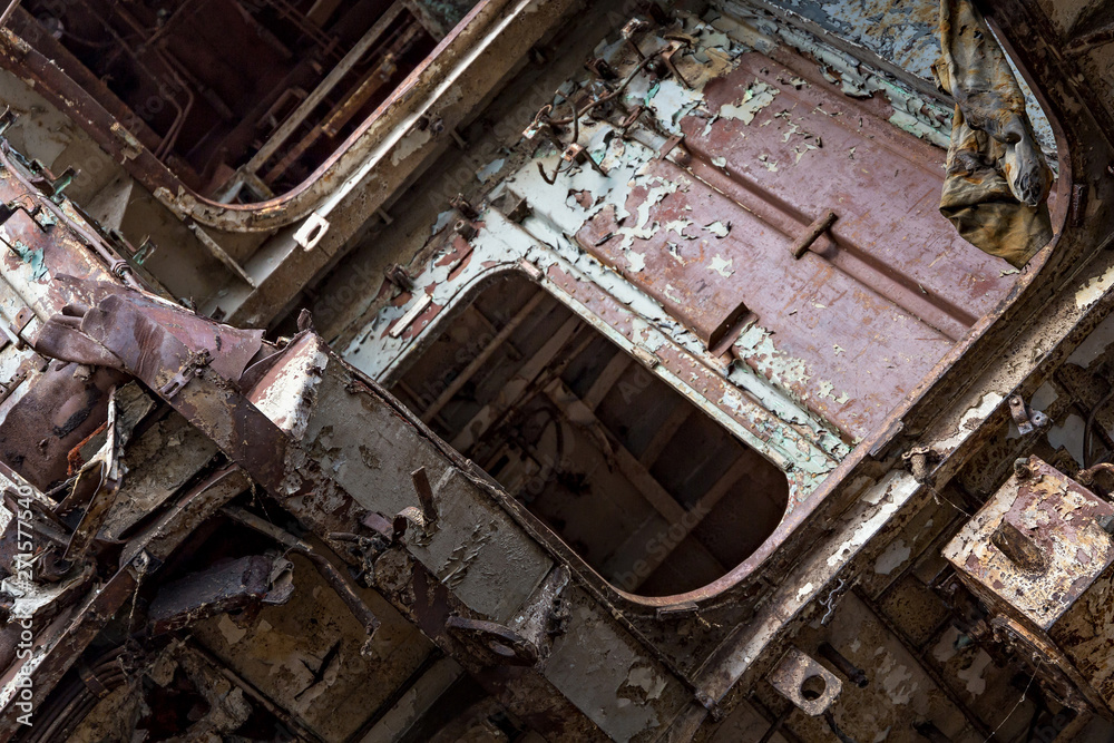 Internal parts of decommissioned marine ship that was cut and left on the shore.