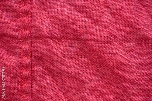 Red linen shirt fabric texture background © Piman Khrutmuang