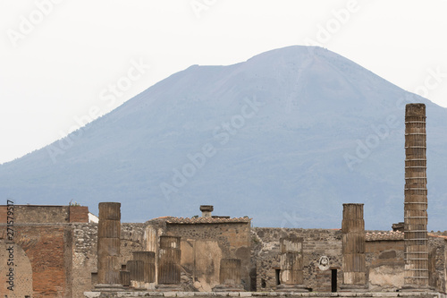Pompeii, Italy - April 21, 2019: archaeological remains of Pompeii with Vesuvius volcano in the background