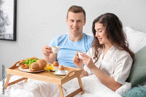 Cute young couple having br...