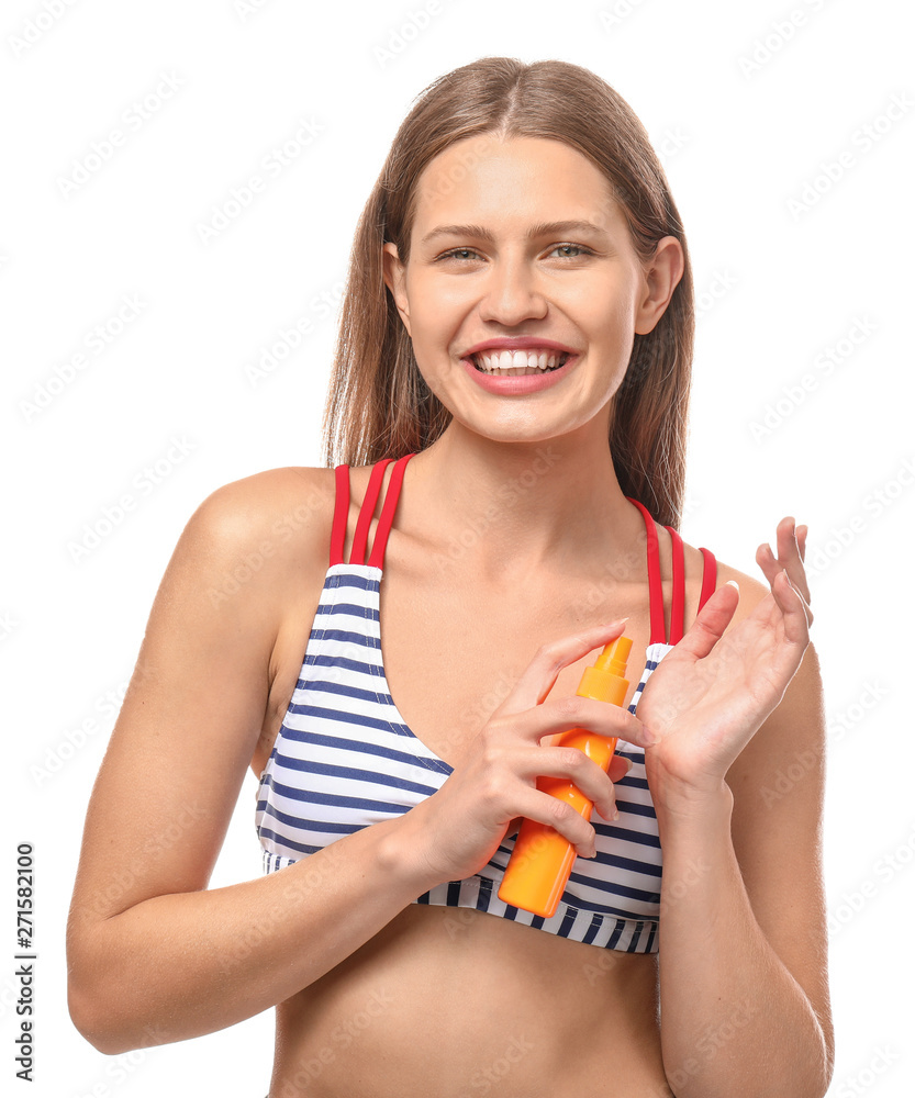 Beautiful young woman with bottle of sun protection cream on white background Beautiful young woman with bottle of sun protection cream on white background