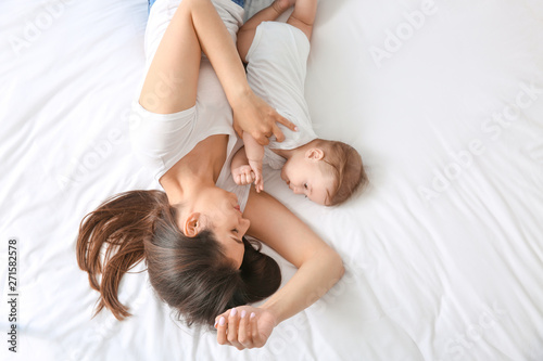 Happy mother with cute litt...