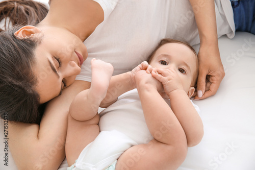 Happy mother with cute litt...