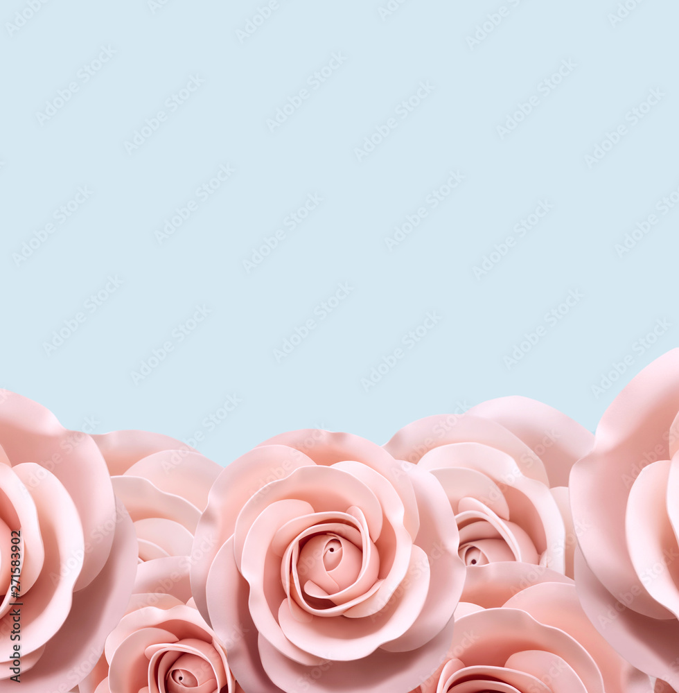 .pink roses at the bottom on a blue background. Place for inscription.