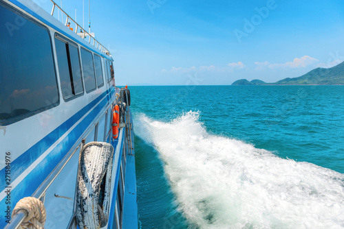 Speed boat with white wake stream in blue sea water. Side view © Pavlo Vakhrushev