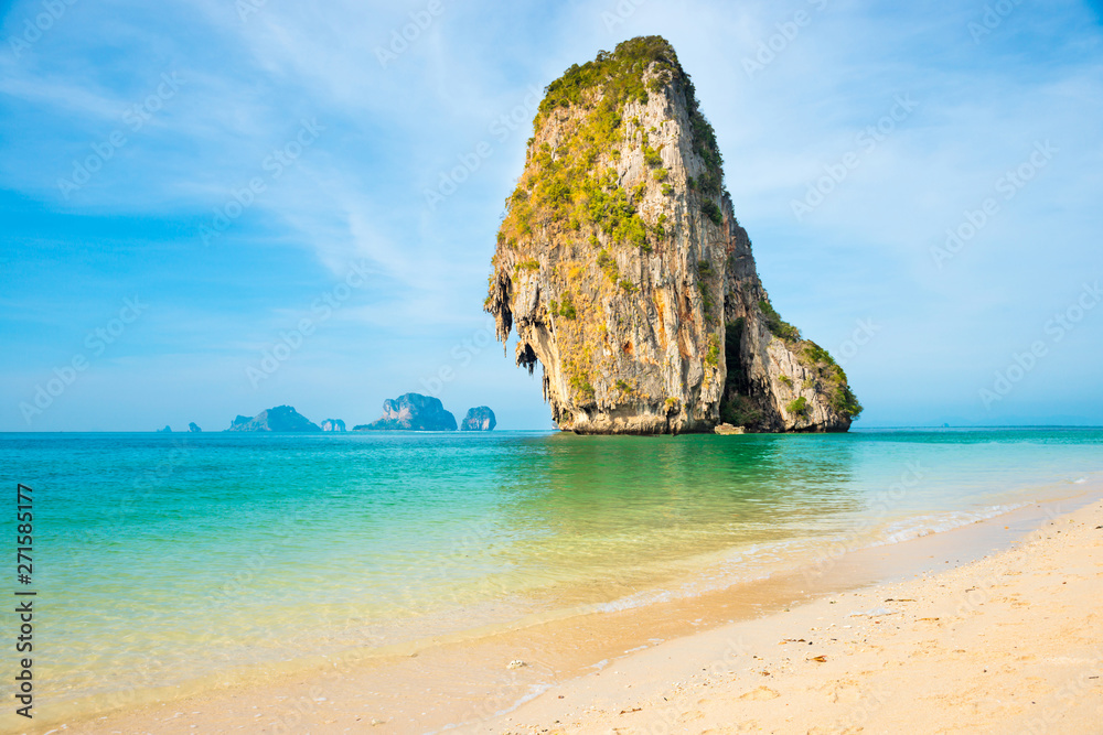 Thailand landscape with tropical sea near sand beach and rock island on foreground and at horizon