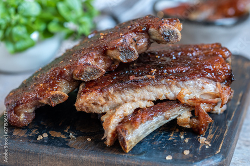 Grilled and smoked pork ribs with barbeque sauce