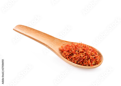 Safflower dried in wood spoon on white background