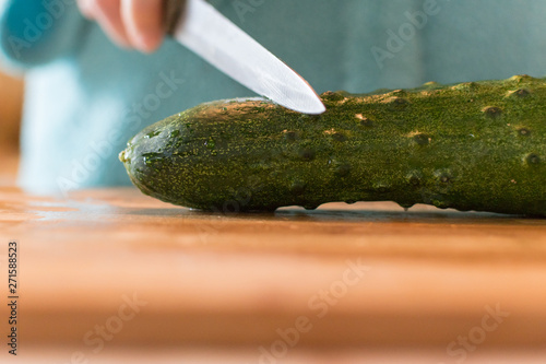 the knife and the cucumber. the concept of circumcision photo