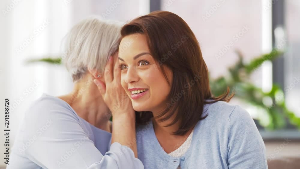 family, generation and people concept - happy smiling senior mother talking to adult daughter at home family, generation and people concept - happy smiling senior mother talking to adult daughter at home